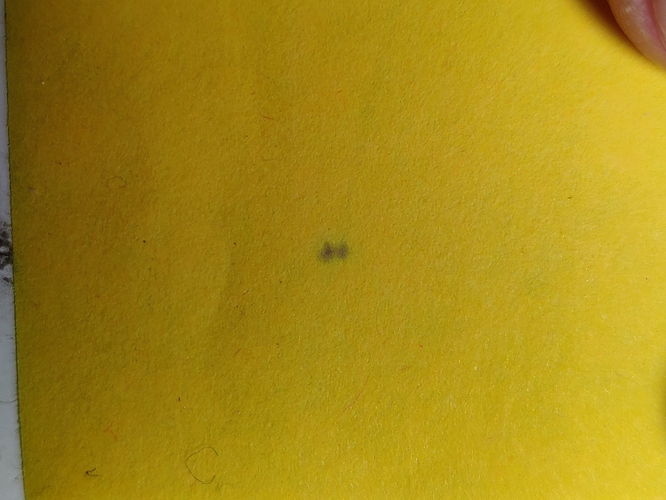 Photo of two dots on a Post-it
